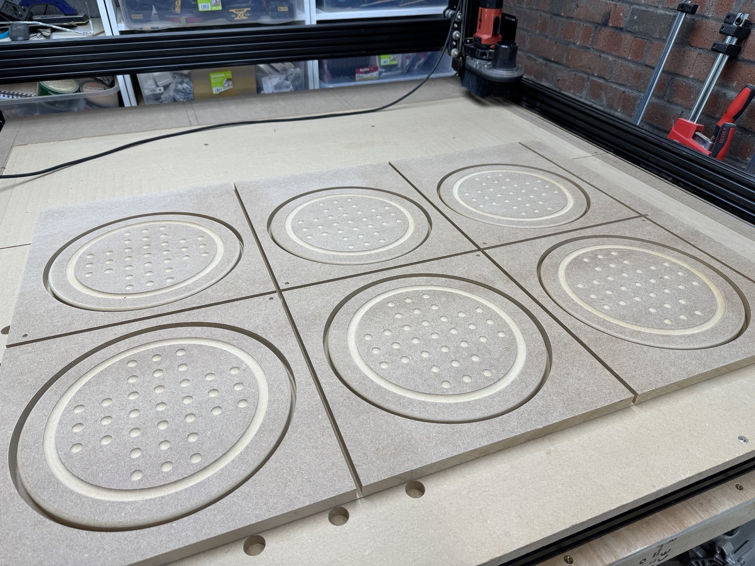 Batch of CNC-routed solitaire boards separated after machining