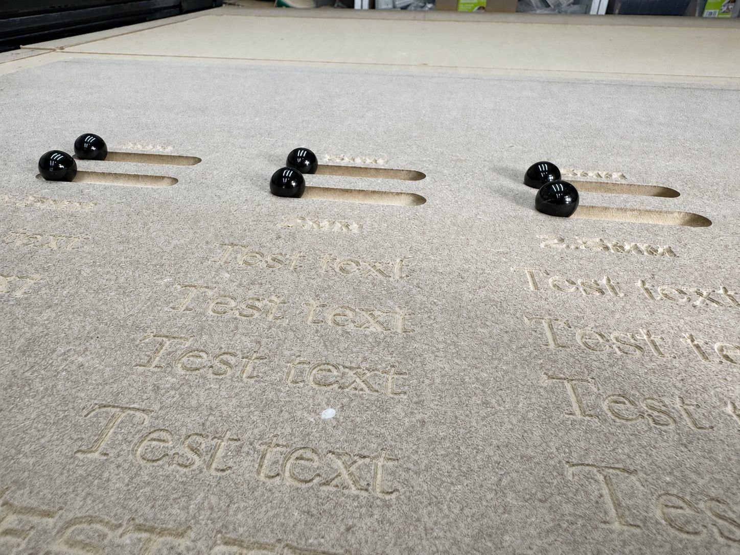 CNC-routed product design board showing machined pockets, slots and drilled features