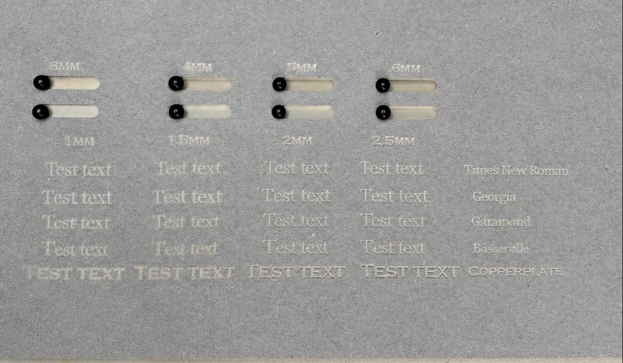 CNC-routed settings board with sample slots, playing pieces and engraved text